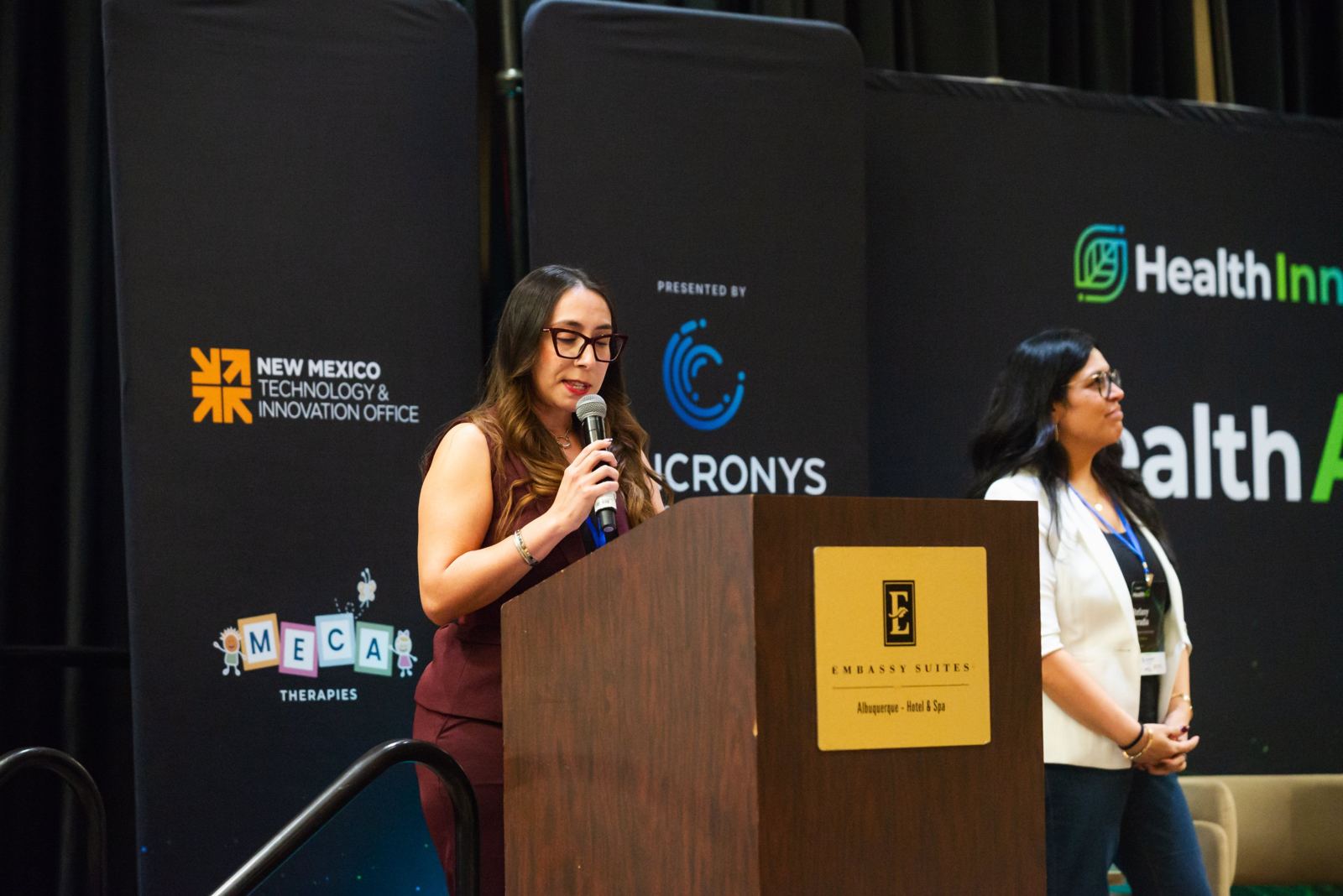 Angelica Maestas delivering the closing charge to the community